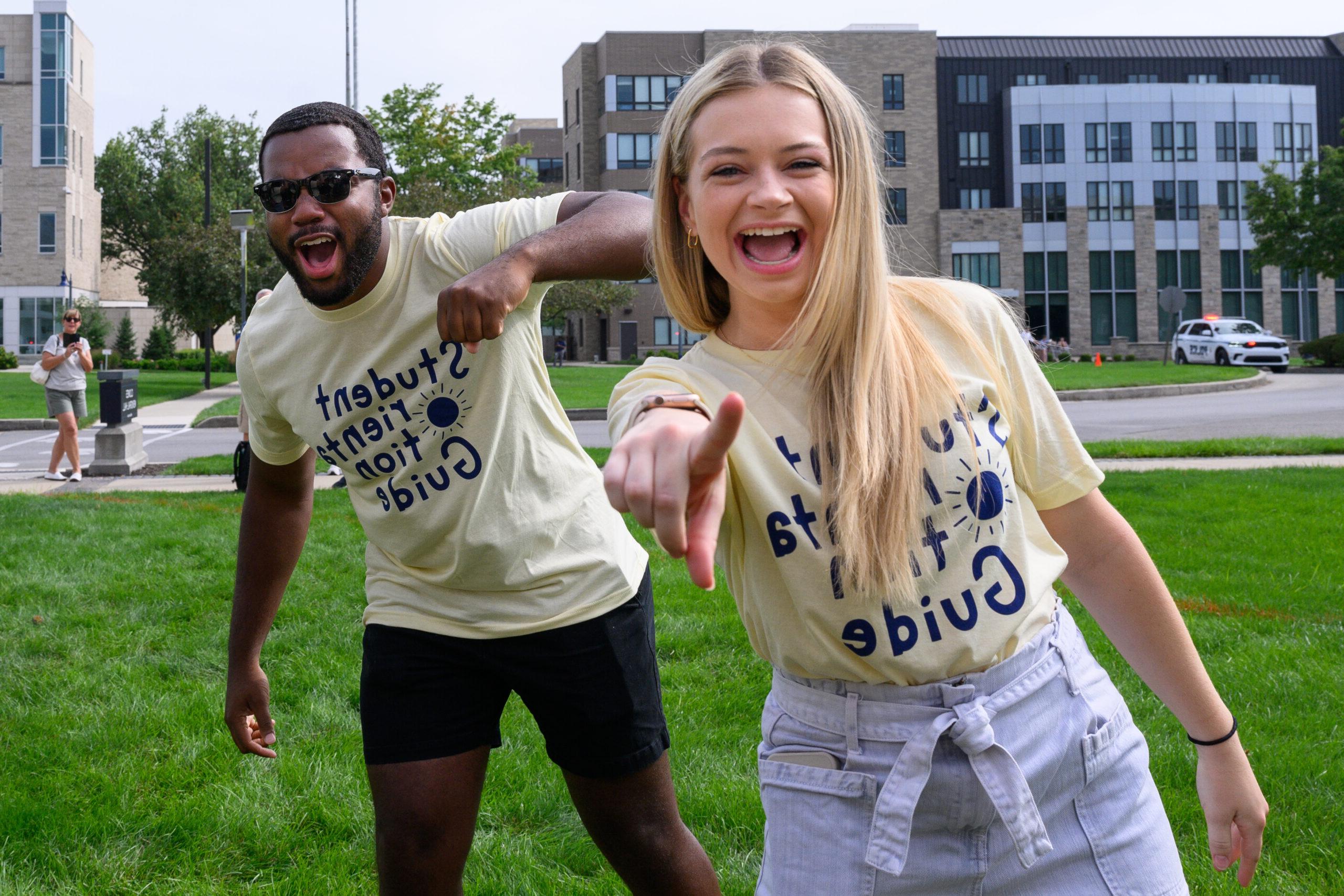 Female and male Butler student smiling at camera while outside.